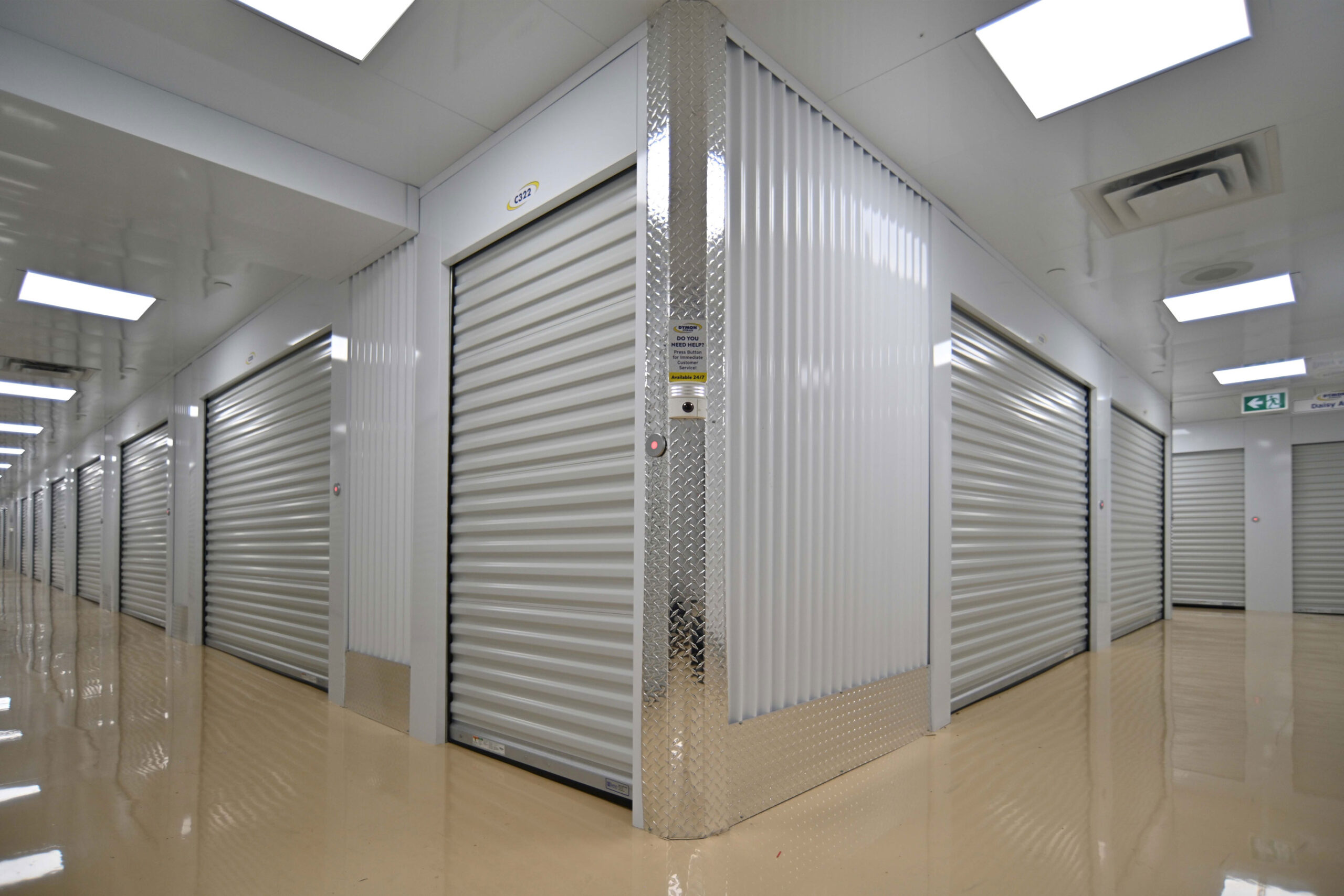 Corner view of two hallways intersecting with storage units