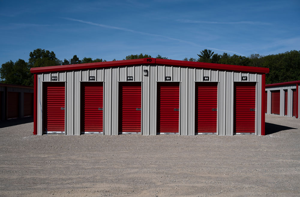 Front view of red and white metal panel storage units