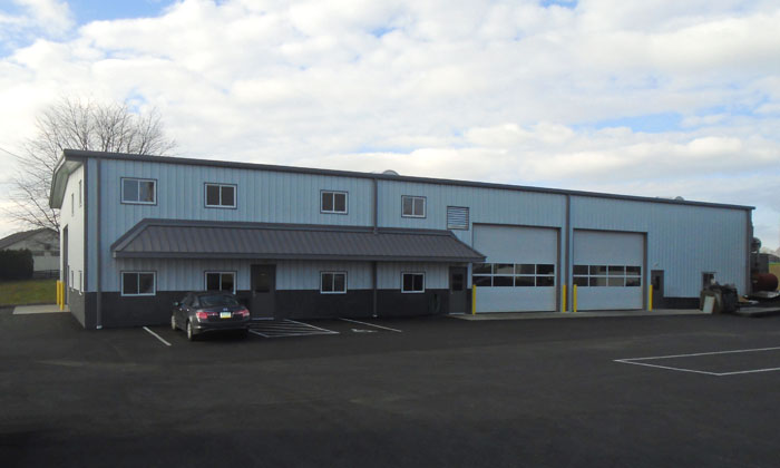 Commercial building exterior with white and gray metal panels